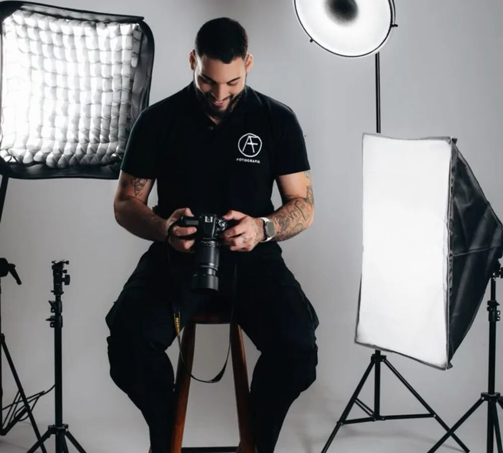 A designer in a studio with softbox lighting